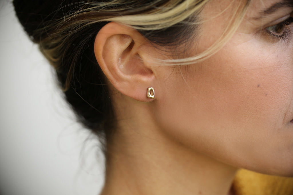 Tiny stud 14k yellow gold earrings, unique hole post earrings by lacuna jewelry