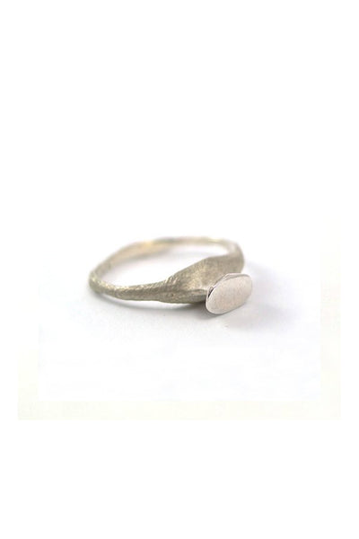 dainty raw sterling silver ring by lacuna jewelry
