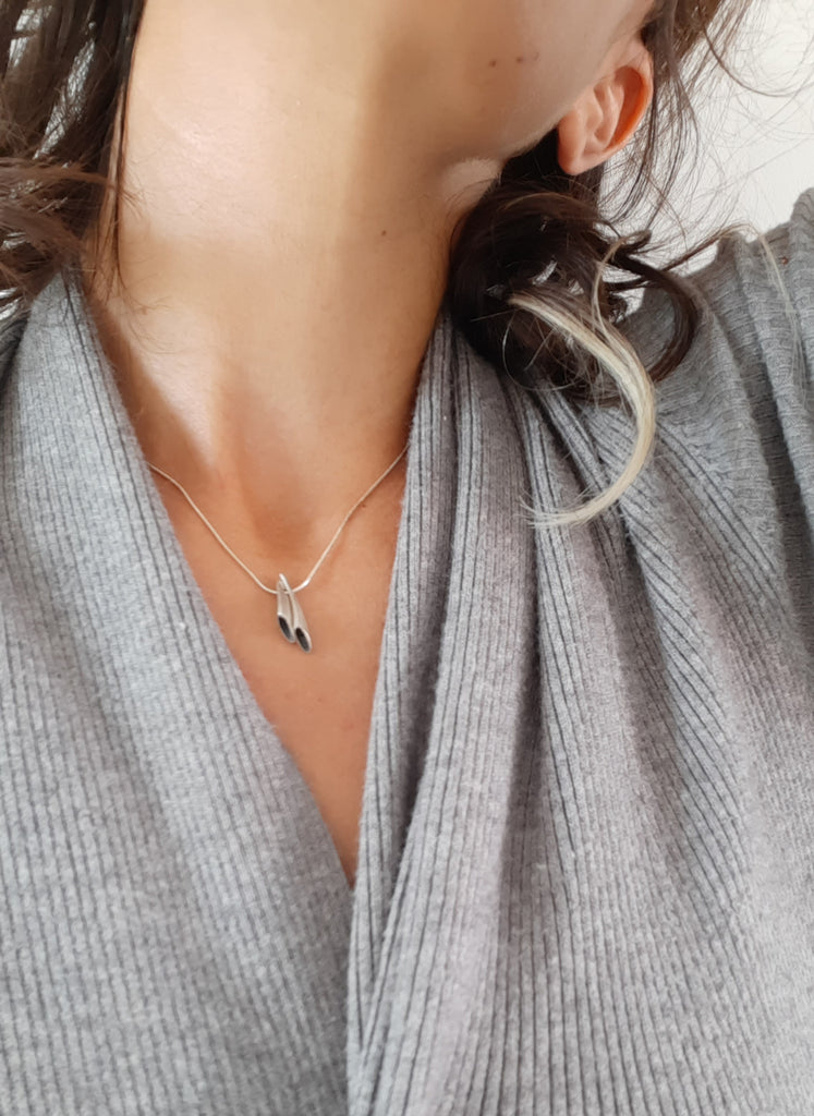 dainty silver charm pendant necklace by lacuna jewelry