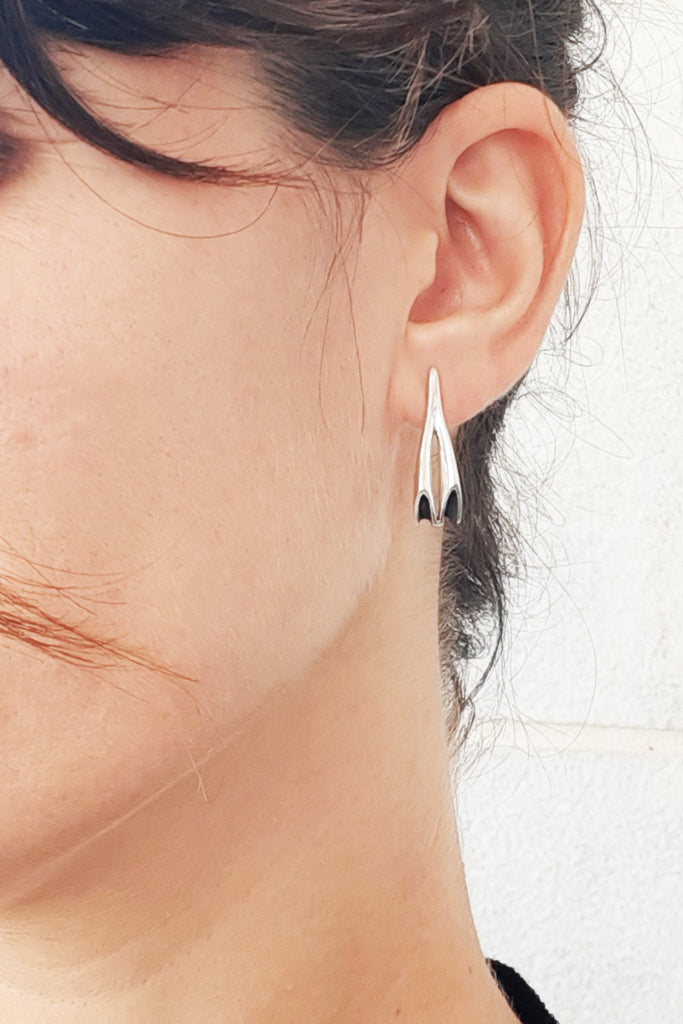 Modern long Silver stud earrings by lacuna jewelry